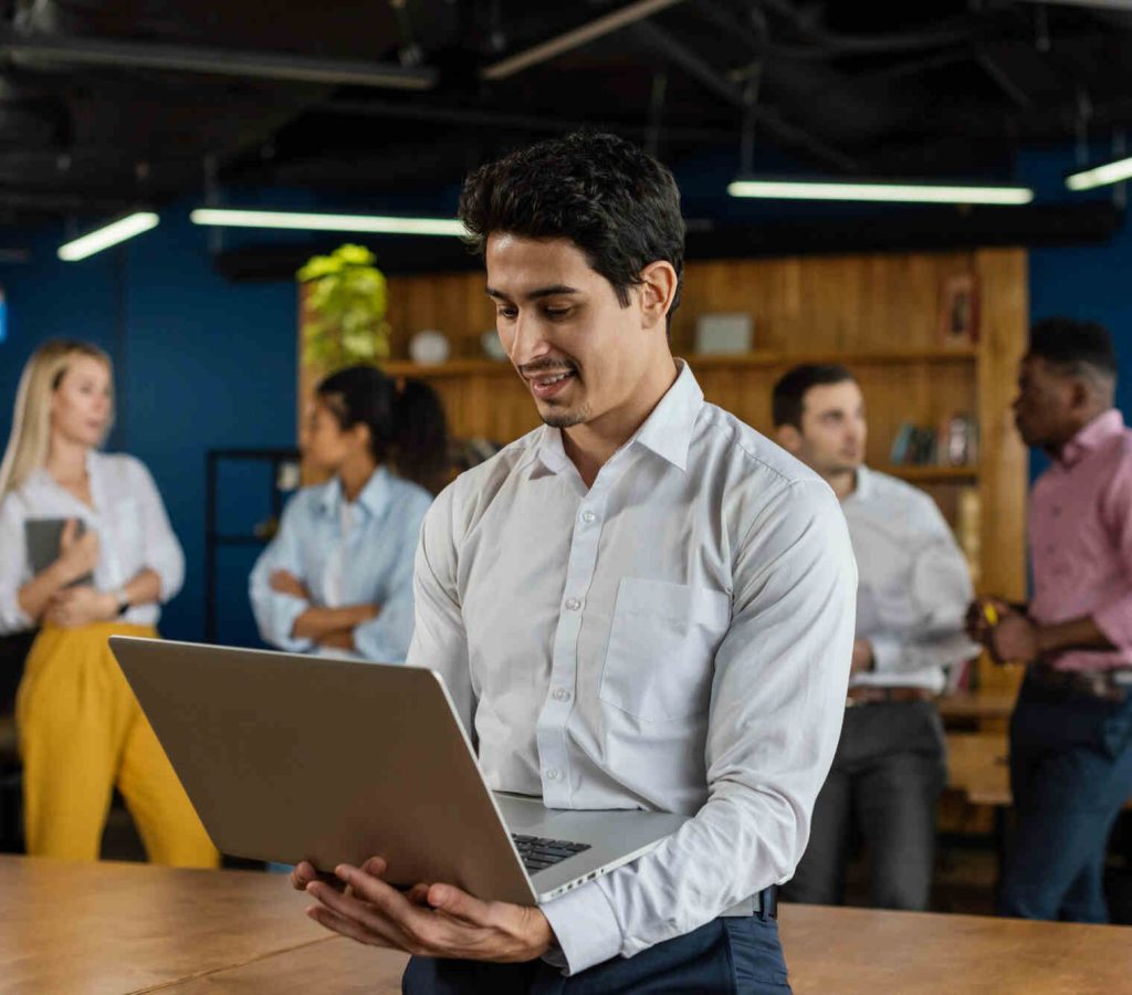 smiley-man-work-holding-laptop (1)